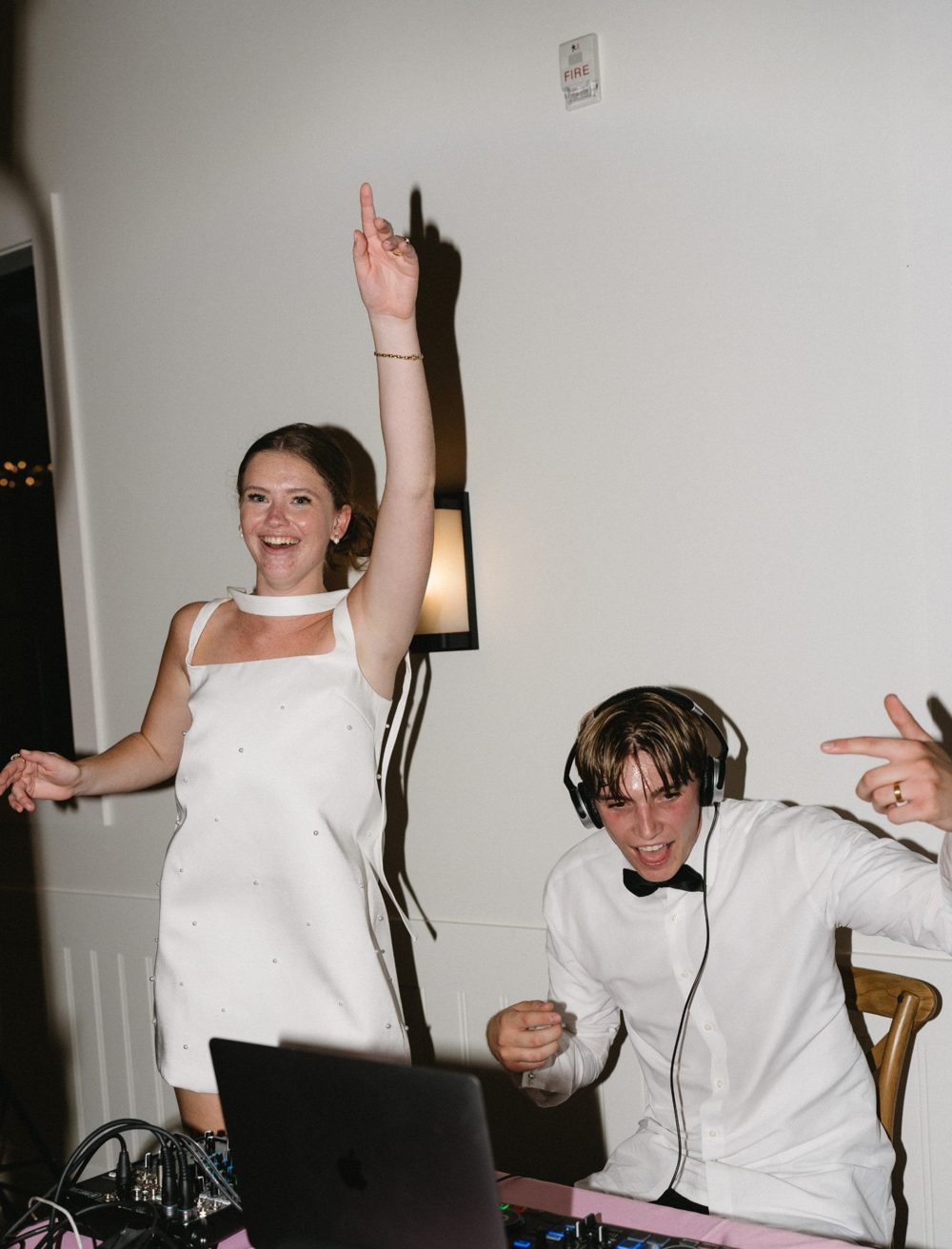 Benjamin and Emma DJing their own wedding reception